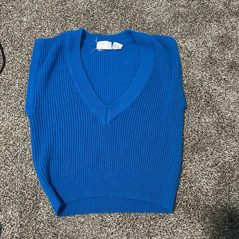 Size medium 
Deep V-Neck 
Sweatervest